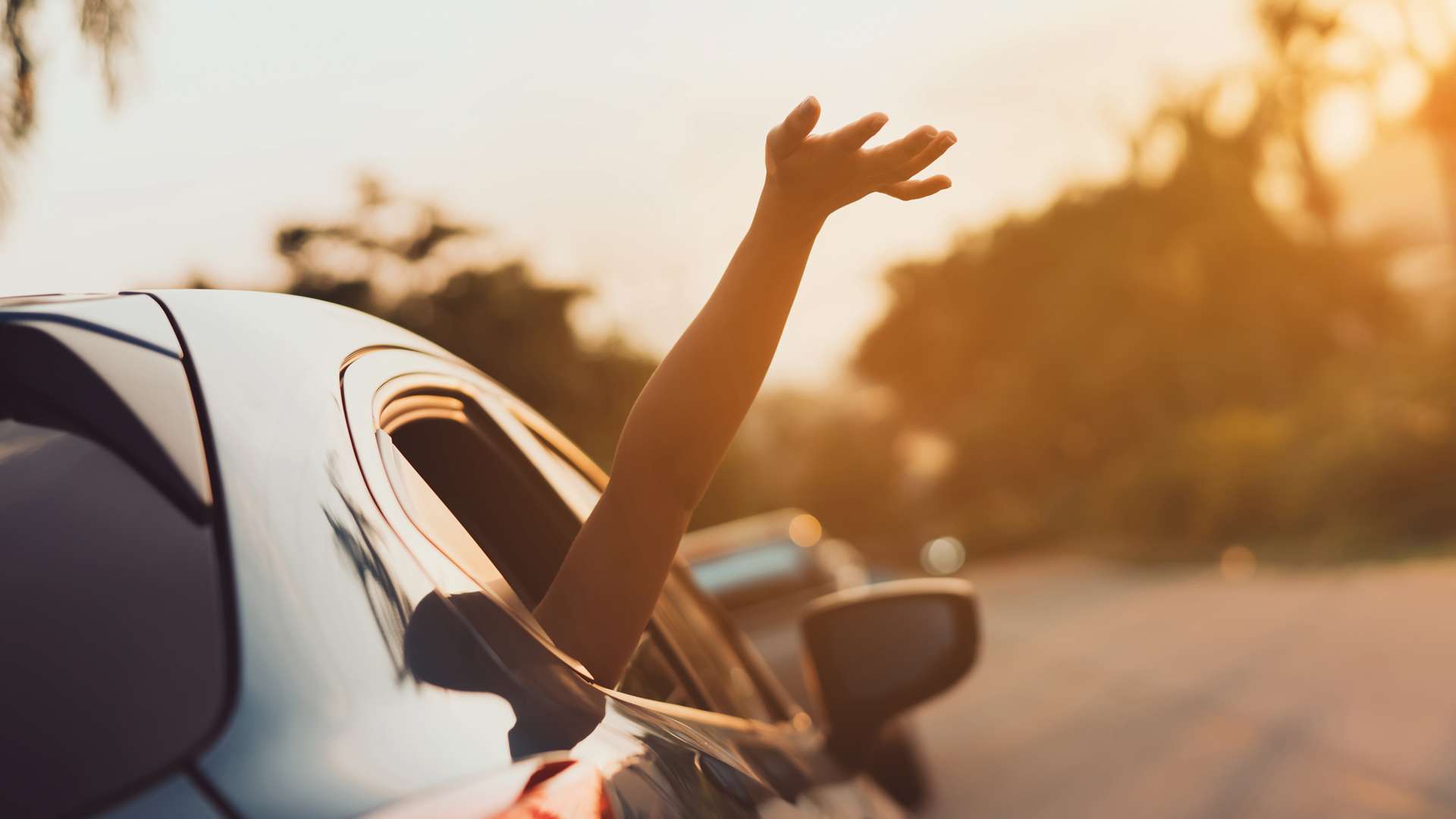 Hatchback Car travel driving road trip of woman summer vacation in blue car at sunset,Girls happy traveling enjoy holidays and relaxation with friends together get the atmosphere and go to destination